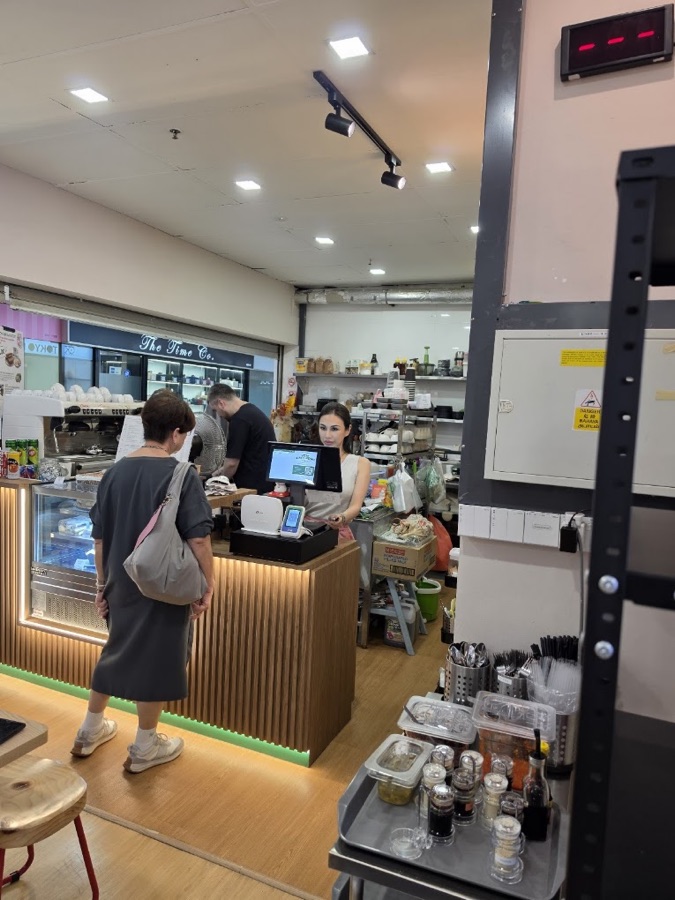 A staff member taking an order at the register