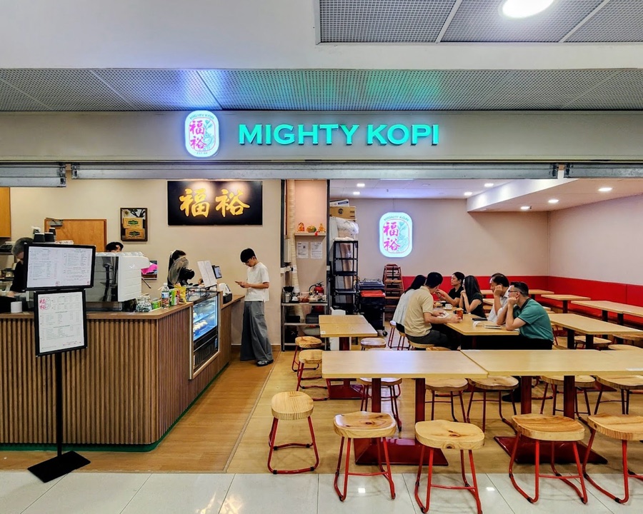 The Mighty Kopi counter and neon sign inside Far East Plaza